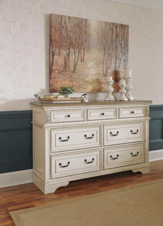 Realyn Queen Upholstered Storage Bed, Dresser, Chest and Nightstand