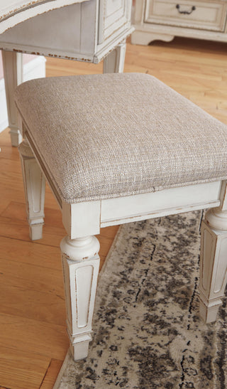 Realyn Queen Upholstery Panel Bed, Dresser, Chest, Nightstand, and Vanity Set