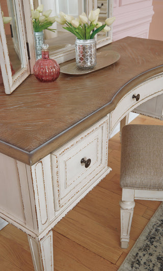 Realyn Queen Upholstery Panel Bed, Dresser, Chest, Nightstand, and Vanity Set